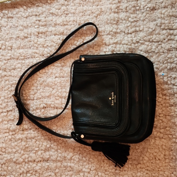 kate spade Handbags - Kate Spade leather crossbody sadle bag with gold hardware and tassle
